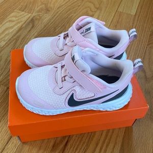 Brand new little girl pink Nike sneakers.